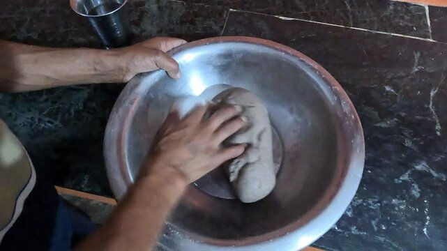 Person Finishing Kneading Ragi (Madua) Flour Dough