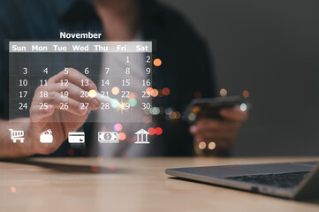 Black friday, 29 November 2024. An individual interacts with digital calendar, highlighting important dates while using cart shopping reflects modern organization methods in tech-savvy lifestyle