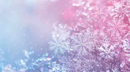 Close-up of delicate snowflakes with a beautiful pink and blue gradient background. Perfect for winter-themed designs and holiday decorations.