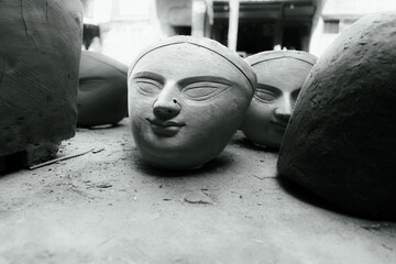 Close-up of goddess durga's head sculpted in clay