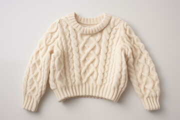 A plain woolen winter sweater in red and white color with no patterns or embellishments, folded neatly on a white surface with subtle lighting.