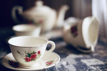An antique tea cup with flower design