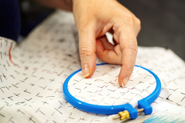 close-up of women's hands delicately measuring a distance with fingers, preparing to start...