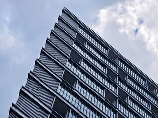 A very tall building that features numerous windows and many balconies