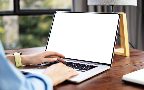 Mockup image of a woman using laptop with blank screen. Transparent. Cut out. PNG