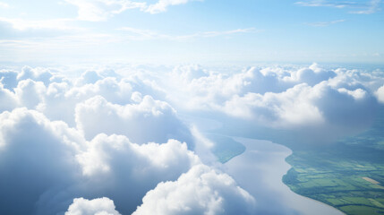 Fototapeta premium Flying through thick white clouds revealing green fields and rivers below