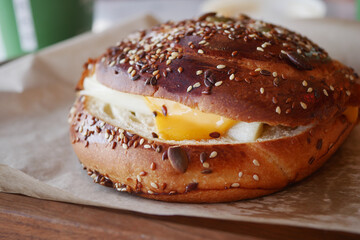 Savory Sesame Bagel topped with Egg and Pickles, a delightful combination for breakfast or brunch