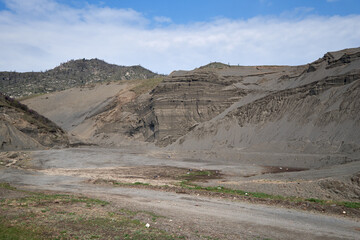 Road to the sand quarry in Altai. Extraction of sand for road works on the ancient terrace of the Katun River