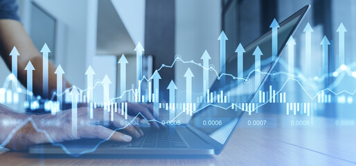 Businessman using laptop, graph diagrams with arrows and numbers