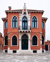 a Venetian Gothic style house on plain white background