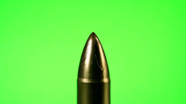 Gun bullet close up on green screen. Generative AI