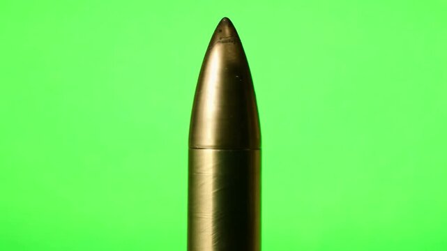 Gun bullet close up on green screen. Generative AI