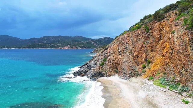 Torre del Budello watchtower tower by Teulada marina, rocky wild beach by cliffs on Sardinia island, Italy by Mediterranean sea
