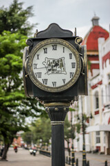 the old street clock in the middle of town in Semarang City Indonesia