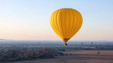 Obraz premium Hot air balloons floating over the temples of Bagan in Myanmar at sunrise Bagan, hot air balloons, cultural travel