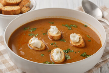 Thick rich fish soup Soupe de Poisson served with croutons and aioli sauce close-up in a bowl on a...