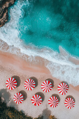 Obraz premium Aerial View of Symmetrical Red and White Umbrellas on Sandy Beach with Clear Green Water