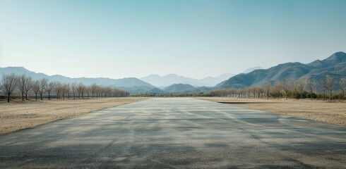 Obraz premium Serene Desert Road Leading to Mountains