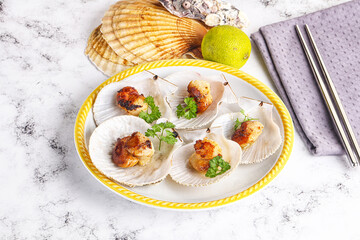 Grilled scallops shell with butter