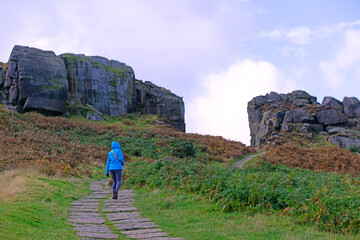 Fototapeta premium Light exercise, walking up to the Cow and Calf, in Ilkley.