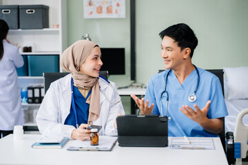 Medical, meeting and laptop for team in discussion, brainstorming and planning. Doctor, nurse on desk show diversity in collaboration, teamwork or workshop .