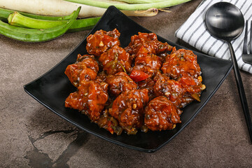 Manchurian chicken with sauce and spices
