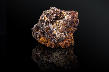 Green mimetite with elongated pyramidal yellow Wulfenite. Specimen from Ojuela Mine, Mapimi, Mexico. photography isolated on black background. macro detail close-up mineral crystal unpolished.
