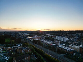Fototapeta premium High Angle View of Luton City Residential District Which is Located Near to City Center Downtown of England UK During Cold Sunset of October 12th, 2024
