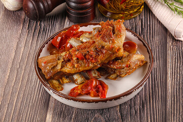 Baked lamb ribs with vegetables