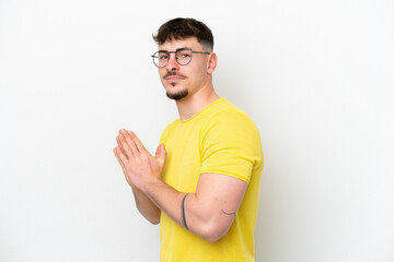 Young caucasian handsome man isolated on white background scheming something