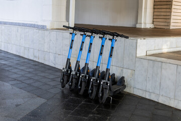 electric scooters lined up on the street