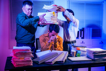 Three men work overtime at night, stressed and overloaded with tasks. They are exhausted, checking...