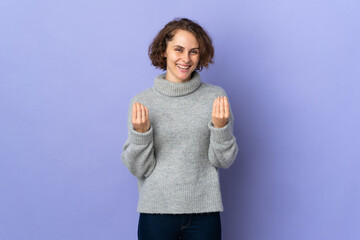 Young English woman isolated on purple background making money gesture