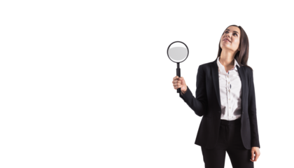 Woman in business attire holding magnifying glass on white