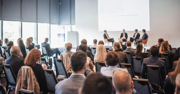 Interview and round table discussion at business convention and presentation. Audience at the conference hall. Business and entrepreneurship symposium.