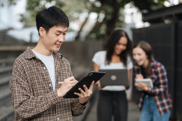 Students Reading Books In University Campus, summer vacation.