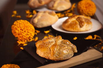 Pan de Muerto. Typical Mexican sweet bread that is consumed in the season of the day of the dead. It is a main element in the altars and offerings in the festivity of the day of the dead.