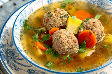 Soup with large meat meatballs.