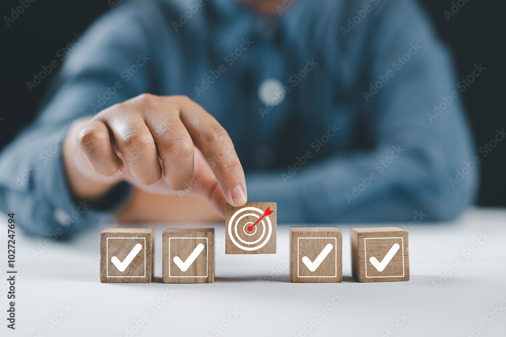 Aufkleber Business strategy planning and quality management concept. Quality control assessment. Business process and workflow development. Wooden block with target goal icon with correct checklist.
