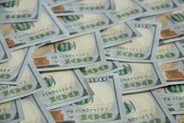 Processed collage of many US hundred dollar bills banknotes texture. Background for banner