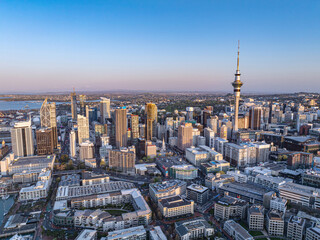Aerial: Panoramic view of Auckland city skyline at sunset, New Zealand
