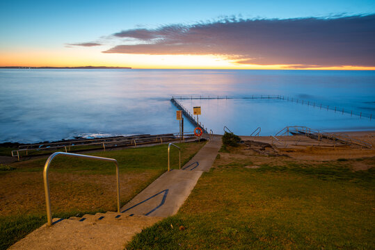 Shelly Park ocean pool and walkway at sunrise