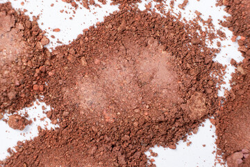 Scattered eyeshadow on a white background. Eye shadow texture