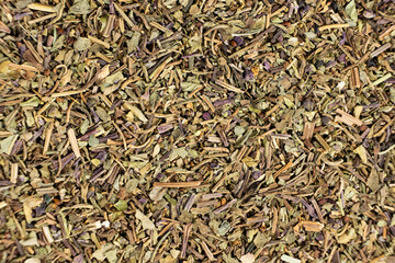 Dry basil spice seasoning macro texture top view