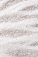 Natural Himalayan Pink Salt Fine Ground Top View Abstract Texture Vertical Background