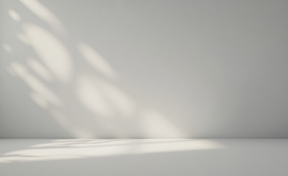 Minimalist gray interior with ethereal light beams. Soft shadows create elegant interplay on walls and floor. Perfect backdrop for product showcases or artistic compositions. Serene aesthetic.

