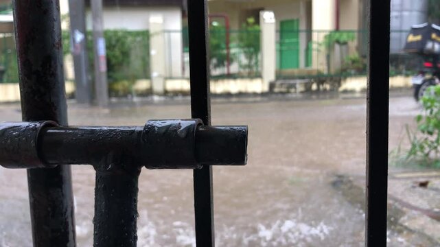 road in the suburb was flooded due to heavy monsoon rain.