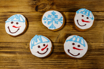 Christmas gingerbread cookies on a wooden background. Top view