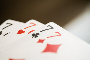 Four Lucky Seven Cards Displaying Unique Designs, Perfect for Gaming or Gambling Imagery and Symbolizing Fortune and Luck in Casino Environments