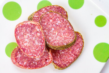 Slices of salami sausage on a plate